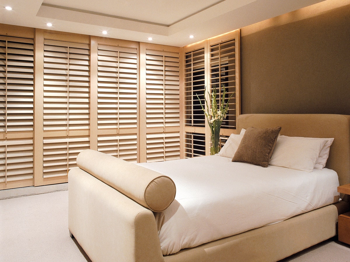 Plantation shutters in an elegant bedroom